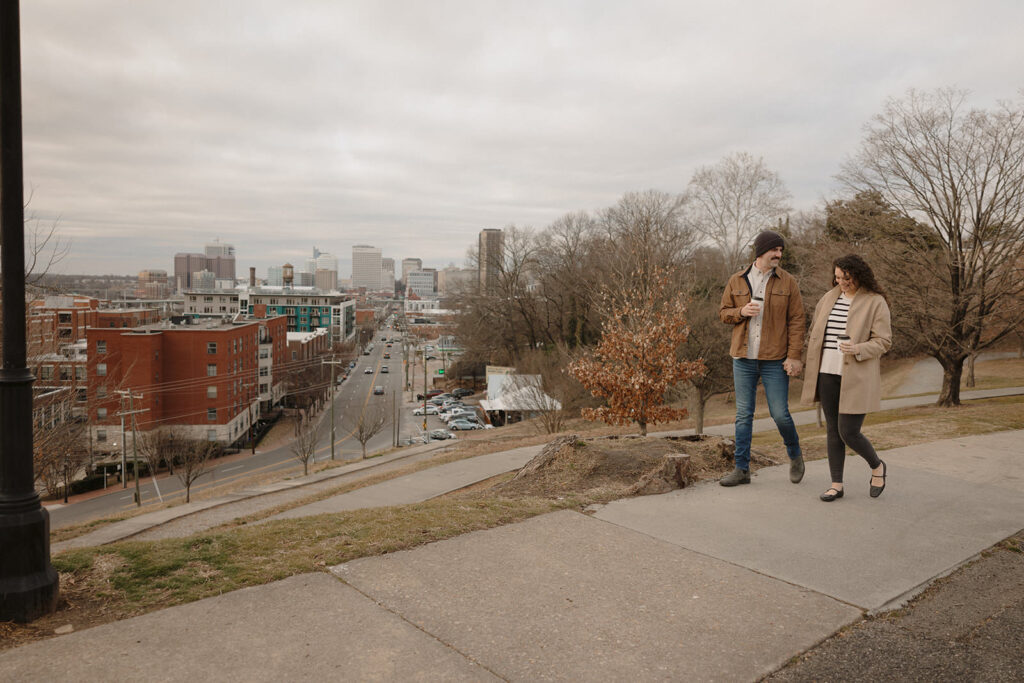 Libby Hill Park engagement session, walking in front of city views